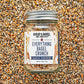 Jar of 'Everything Bagel Crunch' seasoning mix on a textured surface