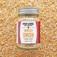 Jar of minced onion spice with 'Burlap & Barrel' label on a textured background