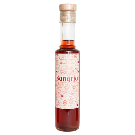 Bottle of sangria drinking vinegar with a white label on a white background