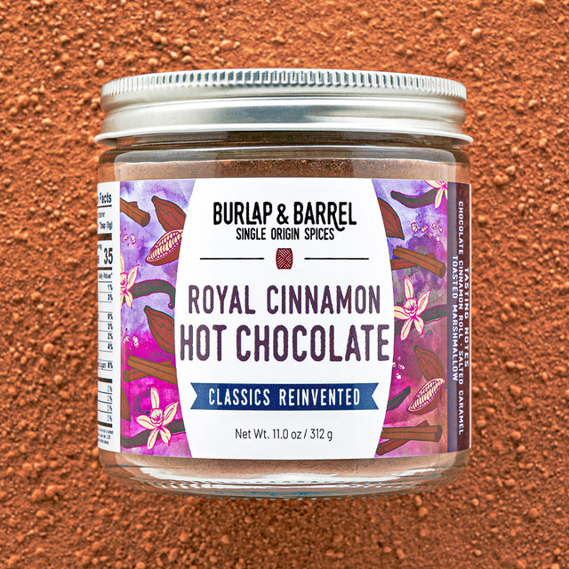 Jar of Burlap & Barrel Royal Cinnamon Hot Chocolate on a brown background