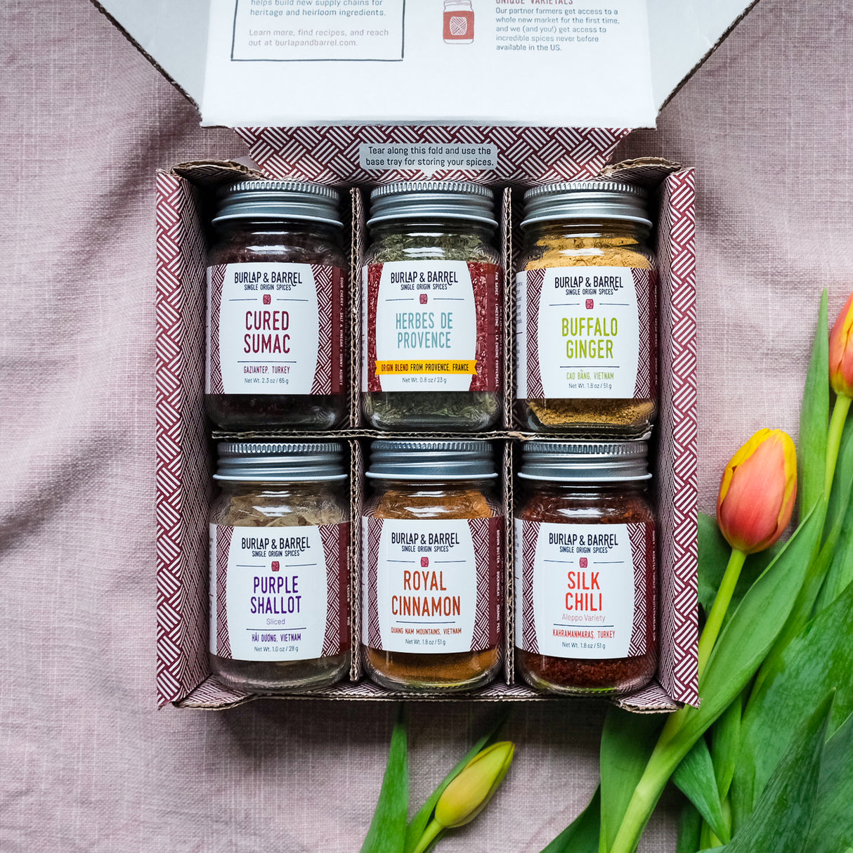 The Spring Essentials 6-Spice Collection in a beautiful gift box with Cured SUmac, Herbes de Provence, Buffalo Ginger, Purple Shallot Slices, Royal CInnamon, Silk Chili from Burlap & Barrel