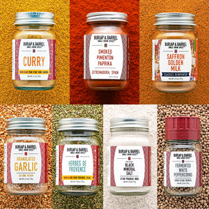 Collage of Burlap & Barrel spice jars with labels on a textured background